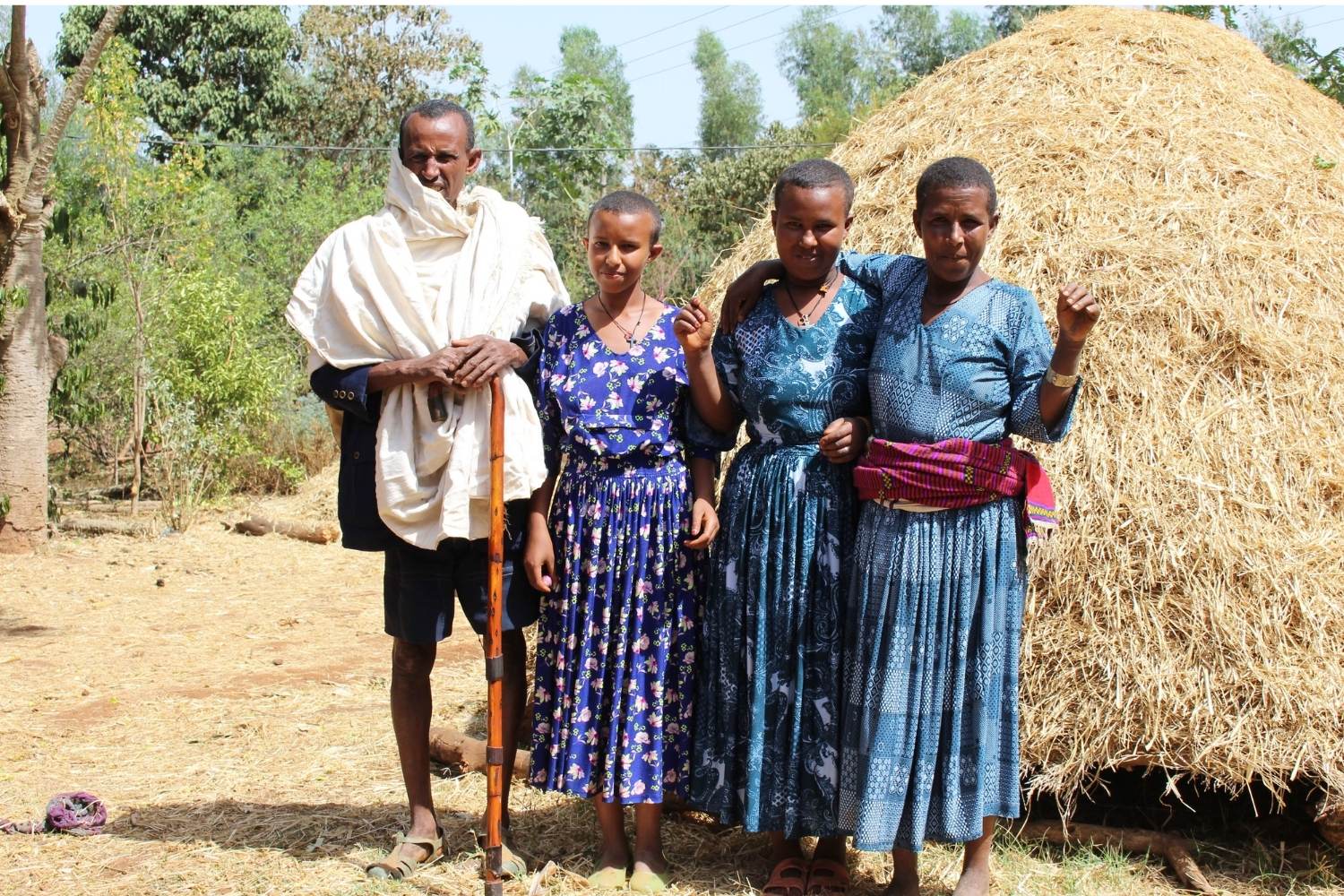 Ethiopian family outside their rural home